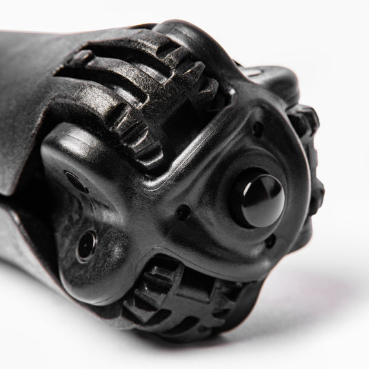 Angled close up image of lower yoke of SWIFT OG showing rugged gearing and aluminum button on white background.