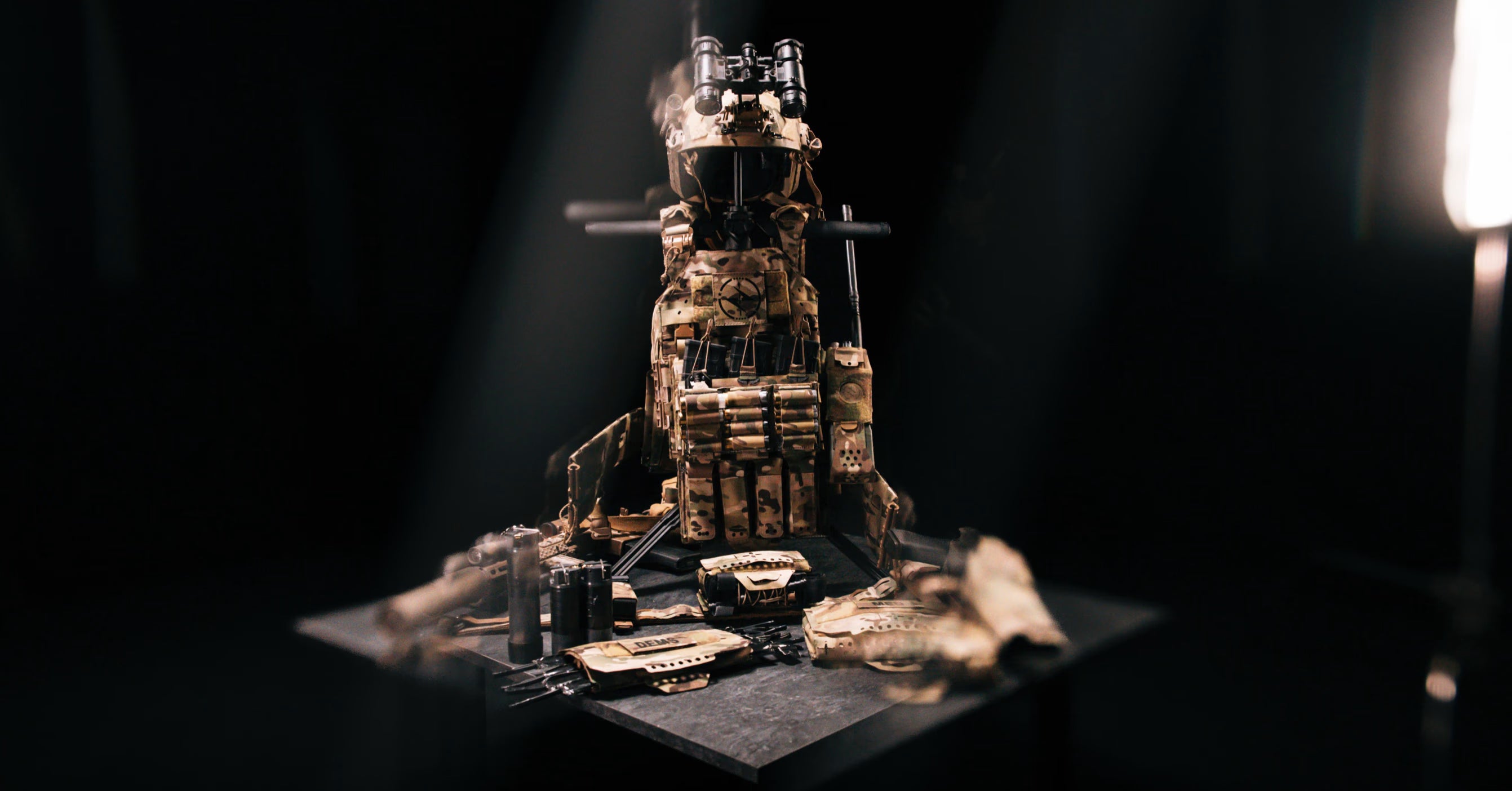 SWIFT gs fully deployed and holding full set of body armor and surrounded by weapons.