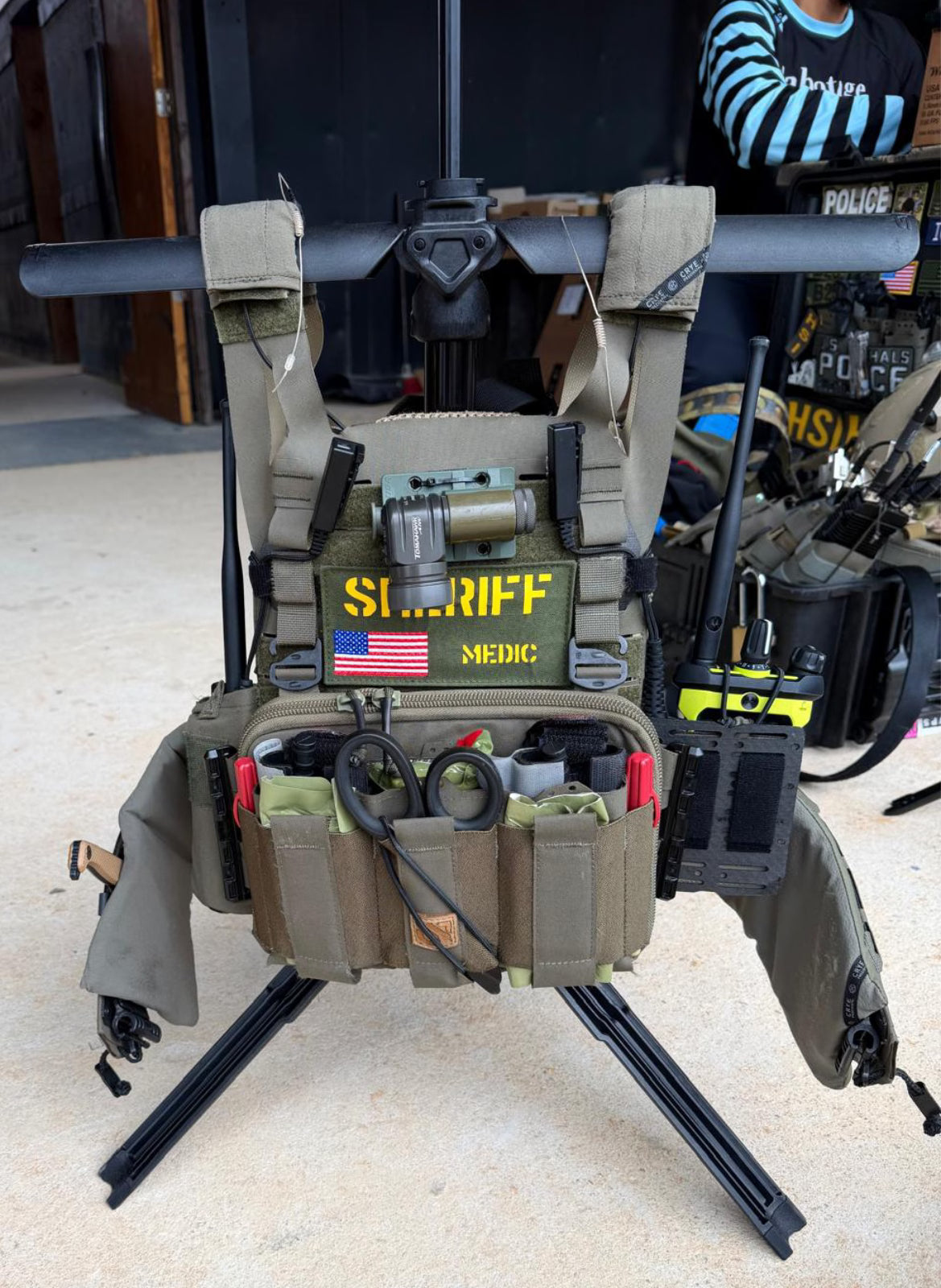 SWIFT OG portable gearstand holding plate carrier and other gear with SHERIFF MEDIC emblazoned on front.