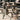 Matched pair of SWIFT OG portable gearstands upright and holding body armor and helmets.